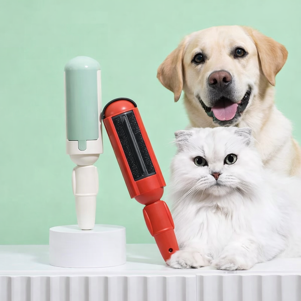 Reusable pet hair remover in mint, red, yellow colors displayed with labrador and white cat